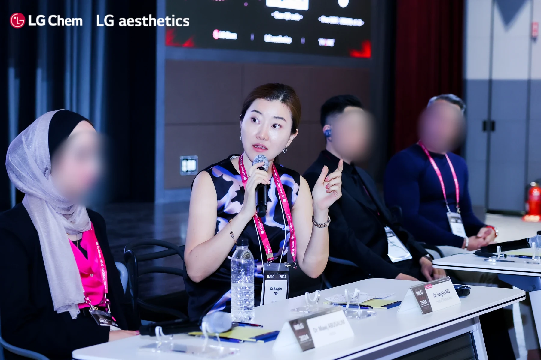 Dr. Jung Im No speaking on an international aesthetics panel in 2024